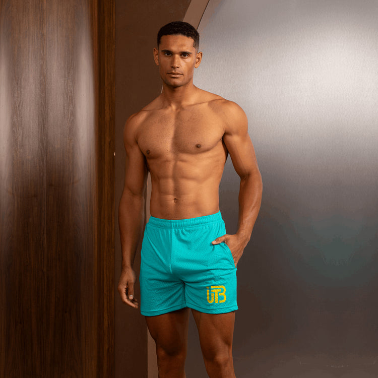 TBIU Mesh Shorts in minimal style - Lightseagreen , relaxed fit, polyester mesh, with internal draw cords. Model wearing size S.